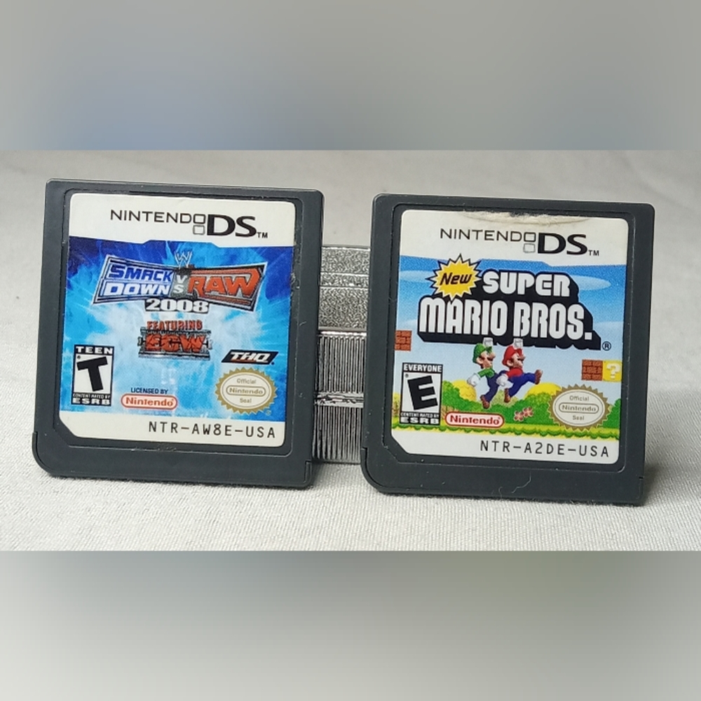 New Super Mario Bros. & Smack Down vs. Raw Nintendo DS game bundle.